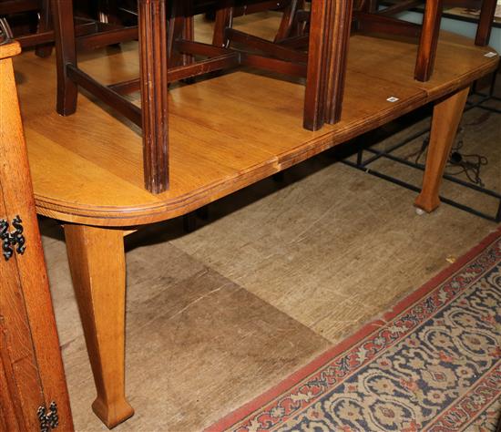 Light oak extending dining table with winder and leaves